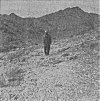 Geo. Adamski standing where Saucer had hovered. Only a few feet from footprints.